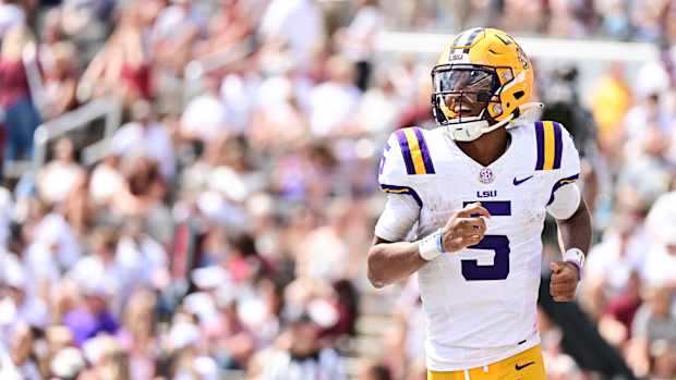 Sep 16, 2023; Starkville, Mississippi, USA; LSU Tigers quarterback Jayden Daniels (5) reacts after a play against the Mississippi State Bulldogs during the second half at Davis Wade Stadium at Scott Field. Mandatory Credit: Matt Bush-USA TODAY Sports  